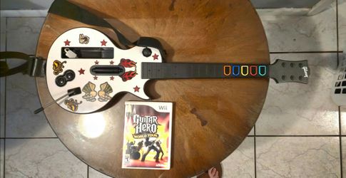 Wii Guitar Hero World Tour Game and Gibson Les Paul Guitar Controller. Includes strap and backplate.