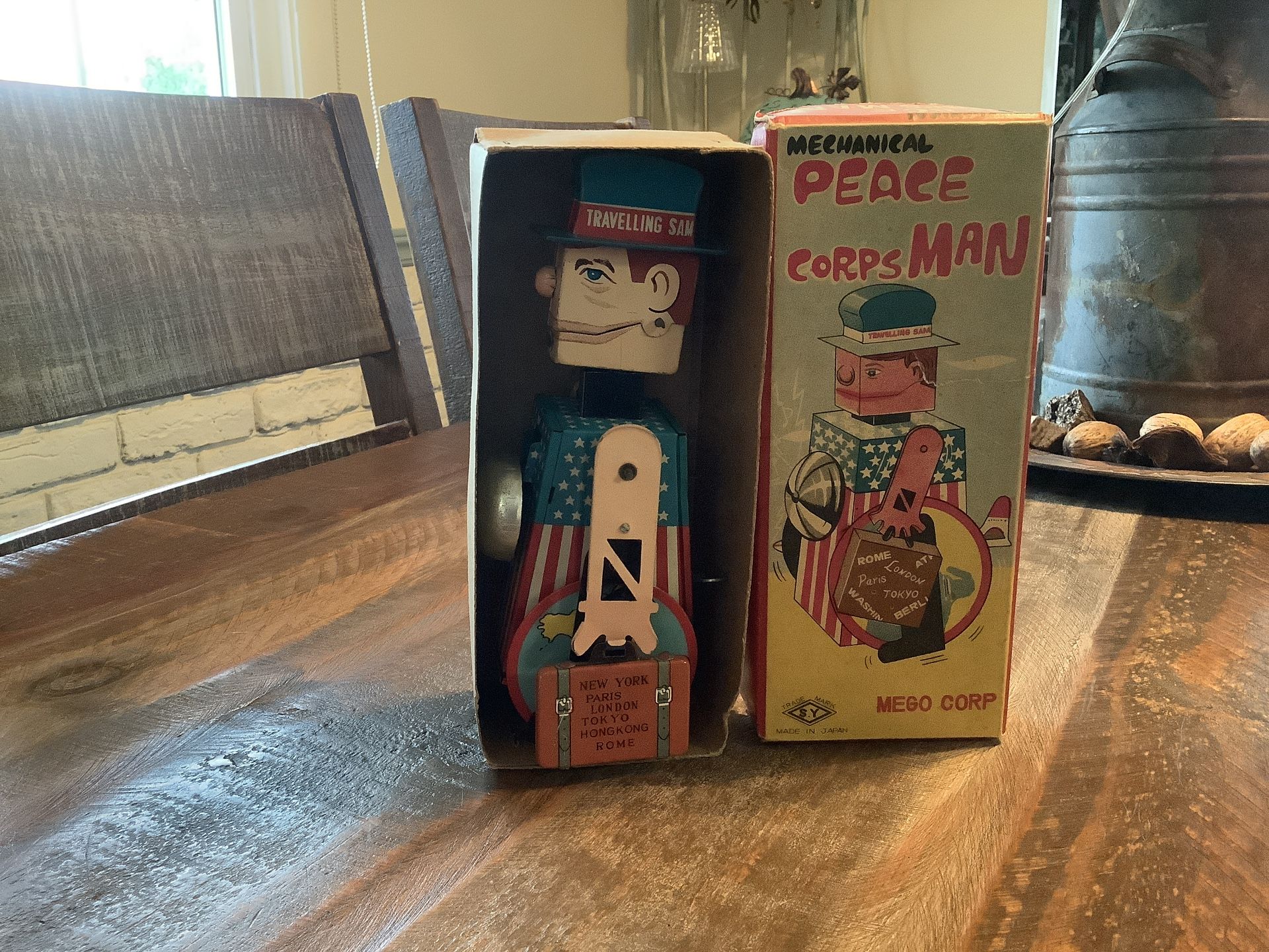 “Peace Corps Man” Wind Up Toy