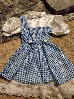 Dorothy size 4-6 and Doc Mcstuffin size 4-6