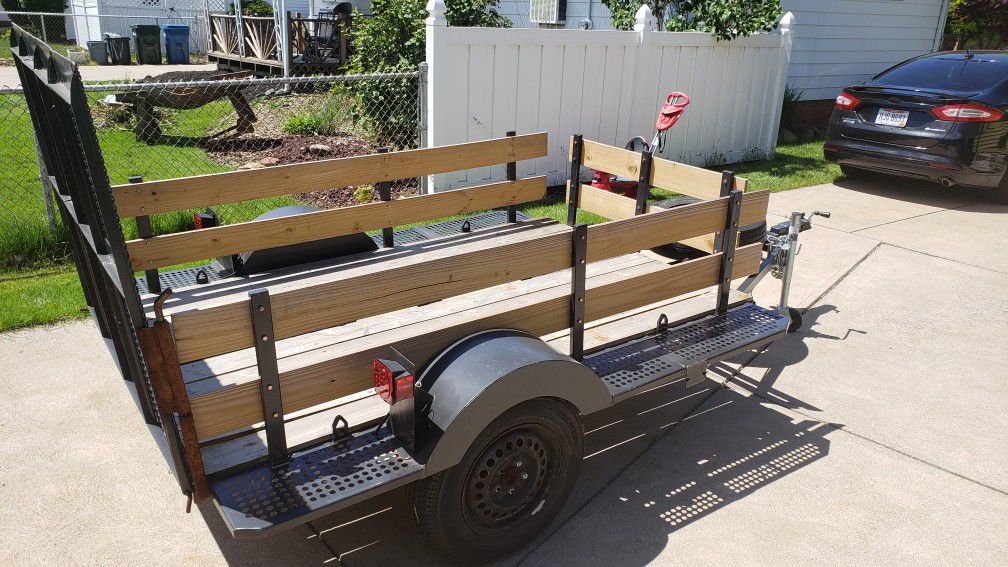 5x8 trailer. Motorcycle tie downs. Removable rails.