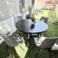 Dining Set: The table is made of wood and comes with four very sturdy chairs; it has some cosmetic imperfections.