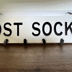 Lost Socks Metal Sign With Hanging Attachments. 