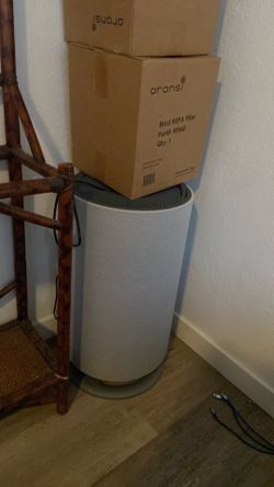 Brand new air purifier with two boxes of filters