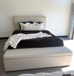 Beautiful Queen upholstered  bed brand new use for display only with storage bench at the bottom. Neutral tan color.