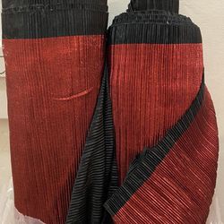 Approximately 30 yards of red metallic pleated shiny fabric