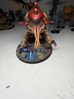 Tyranid Haruspex for Warhammer 40,000. It is fully assembled and painted, with a custom scenic base featuring two fallen Ultramarines
