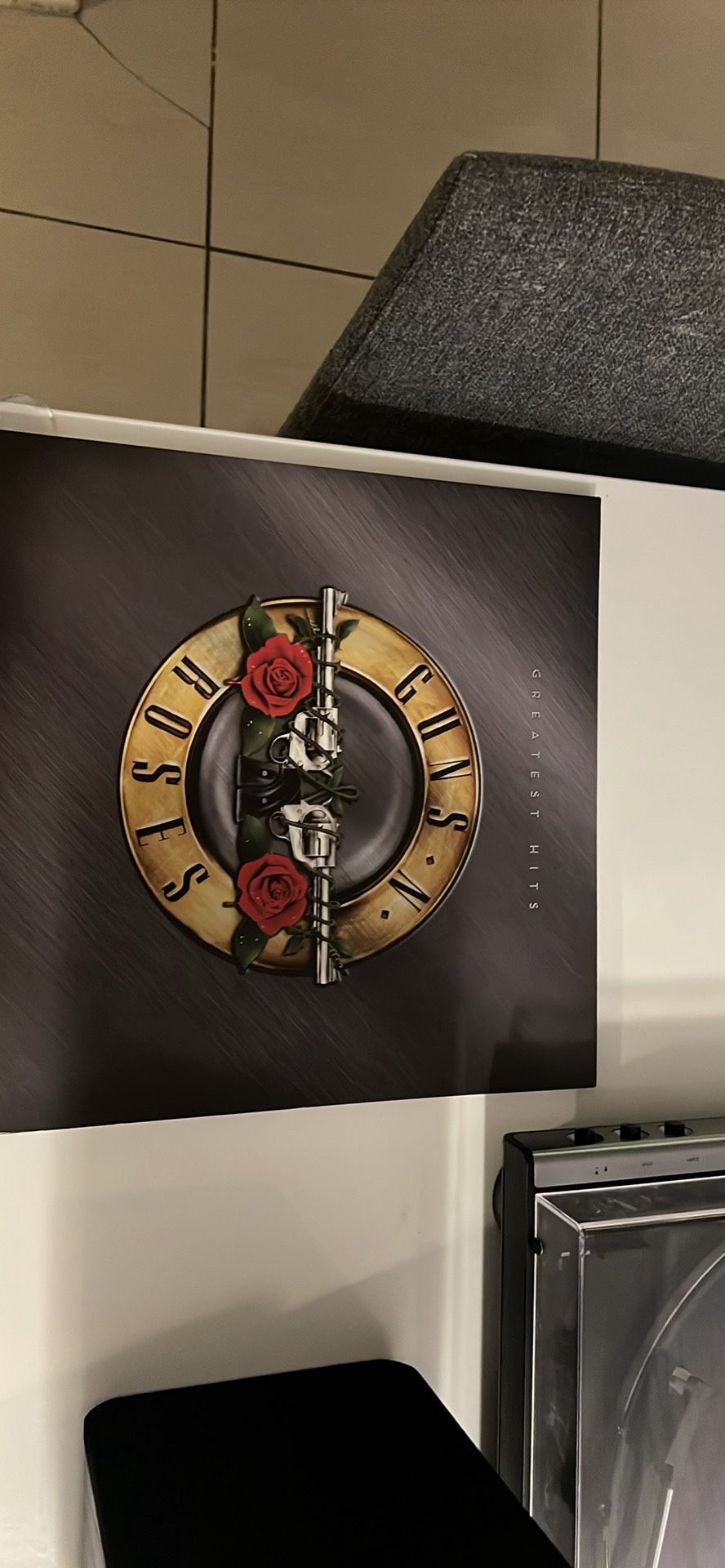 Audio technica record player with two book shelf speakers and guns and roses vinyl record