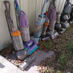 FIVE DYSON VACUUMS FOR PARTS OR REPAIR 