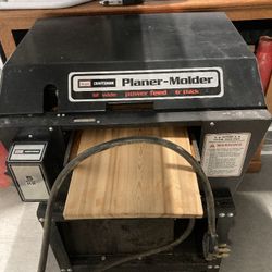 Plainer, 12" Wide X Up to 6" In depth. 