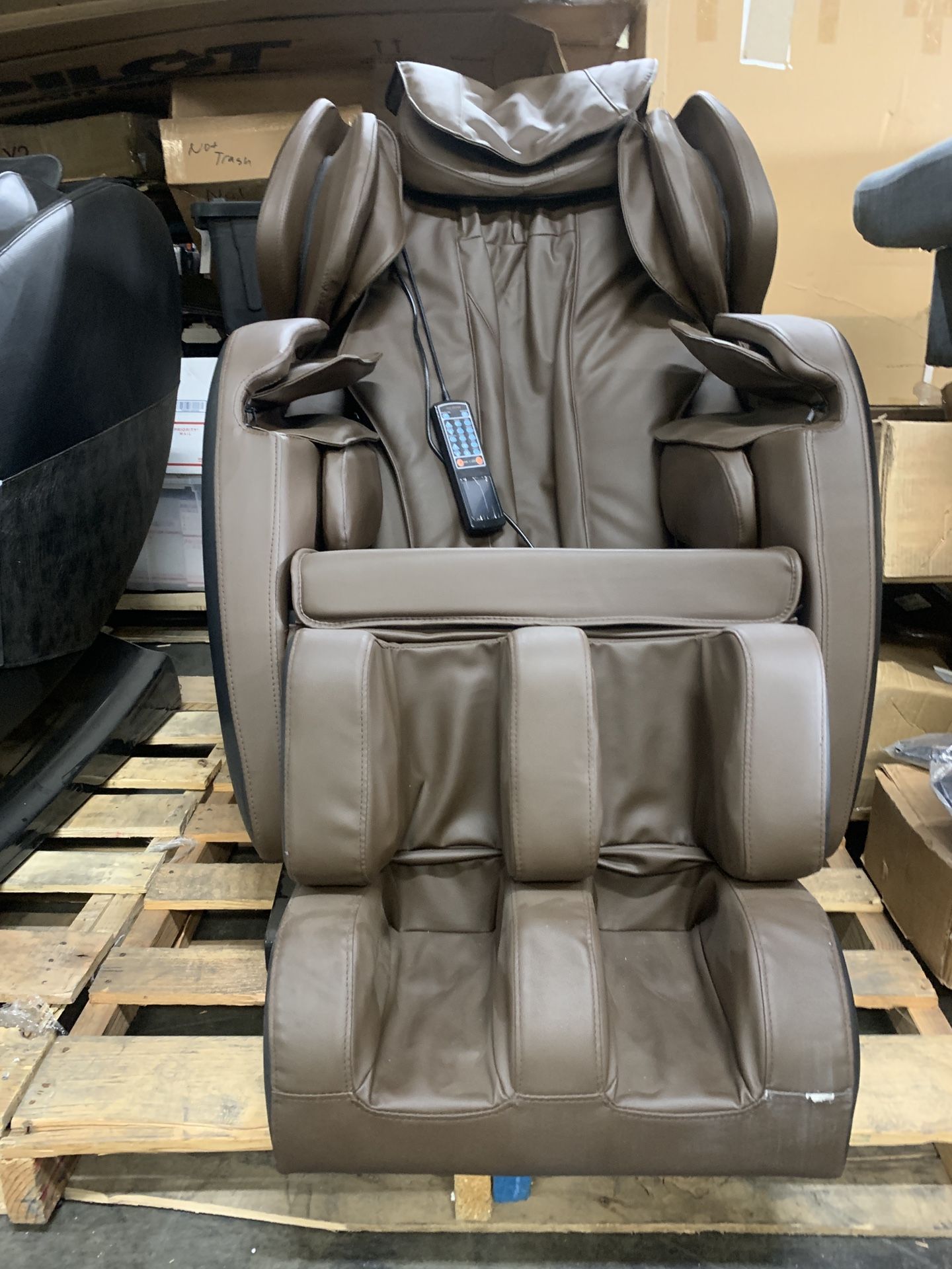 Zero gravity massage chair with full body shiatsu, vibration, heat, and foot roller.