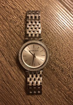 Woman’s silver Michael kors watch