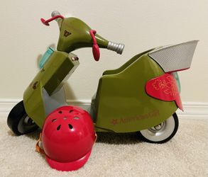 $40 - American girl retired scooter with helmet. 11"Hx11"Wx17"L. 