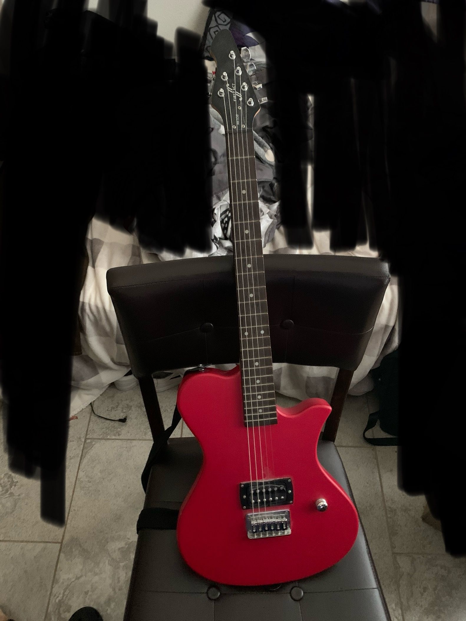 First Act red electric guitar