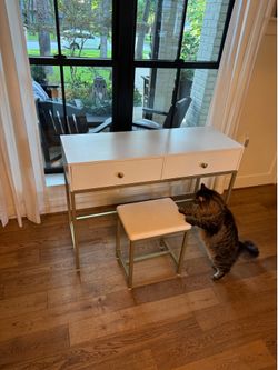 White desk + stool, with dull golden accents