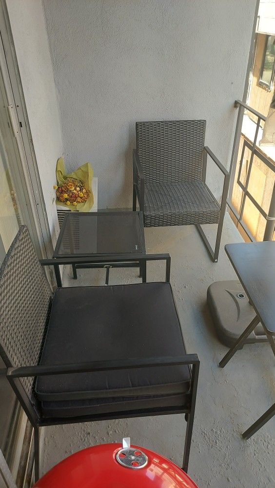 Terrace chairs, table and sun umbrella
