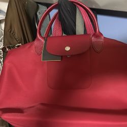 Longchamp Le Pliage or Le Pliage Neo tote bag.