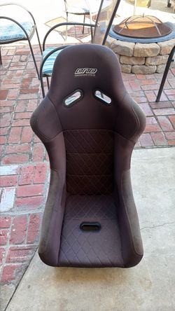 This is a DND Performance Interior "Monakos" style fixed-back bucket seat.