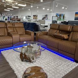 Brown power, reclining sofa, and loveseat