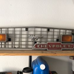 Mustang grill and Chevy truck emblem .