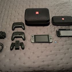 Nintendo Switch Bundle – 2 Pro Controllers, 256GB SD Card, Dock & Cases