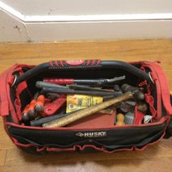 Husky Tool Bag With Tons Of Random Tools some still in containers and packages. Husky Is The Toughest Name In Tools.