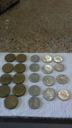 Australia Dollars And Canada quarters And Nickels.