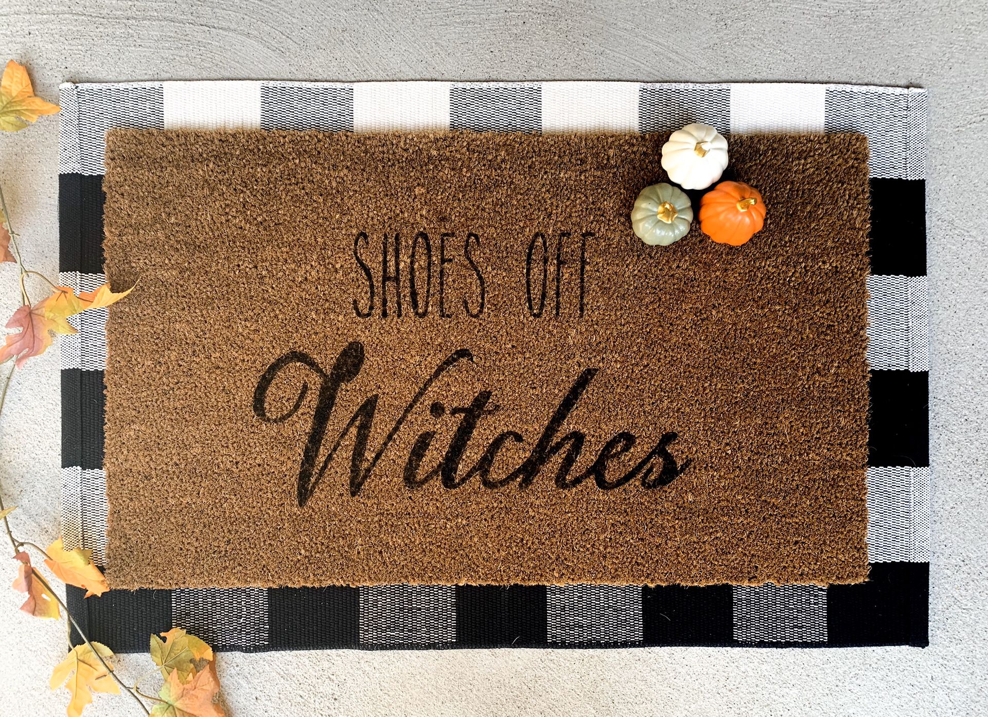 “Shoes off witches” door mat