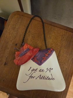 Red hat ceramic hanging plaque.