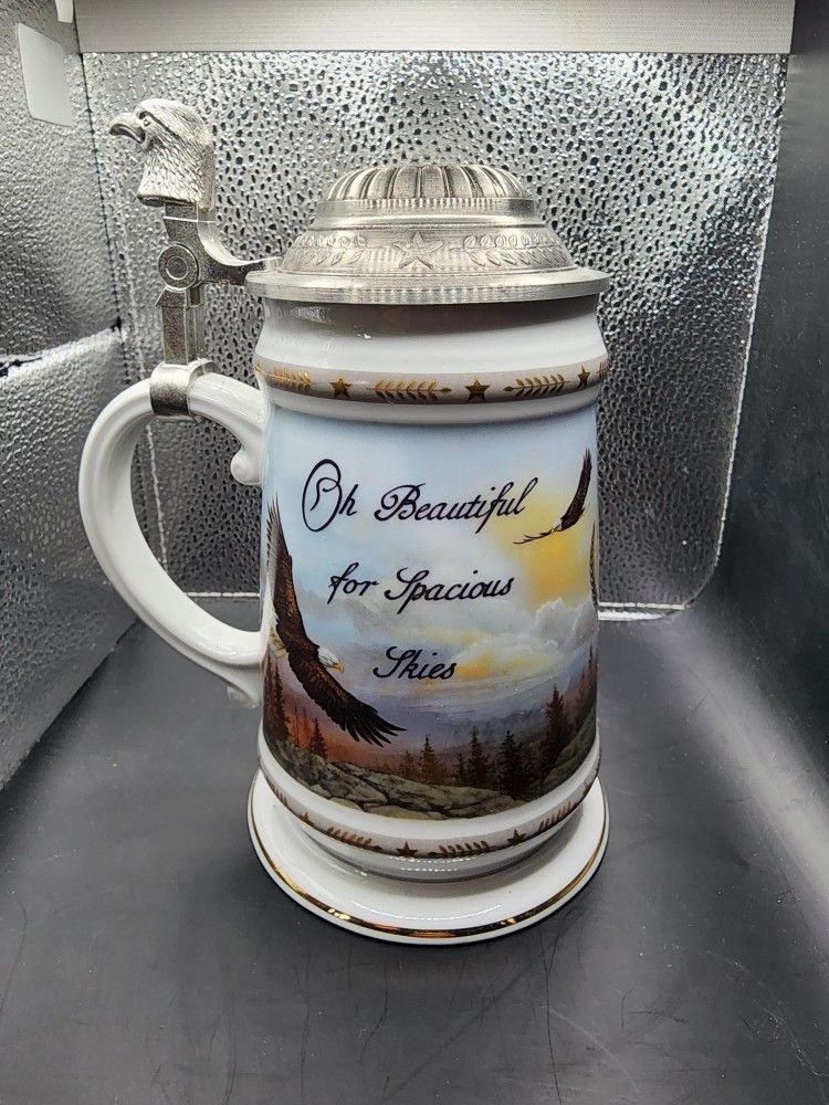 The Longton Crown "Spacious Skies" lidded beer stein is part of the "America the Beautiful" series