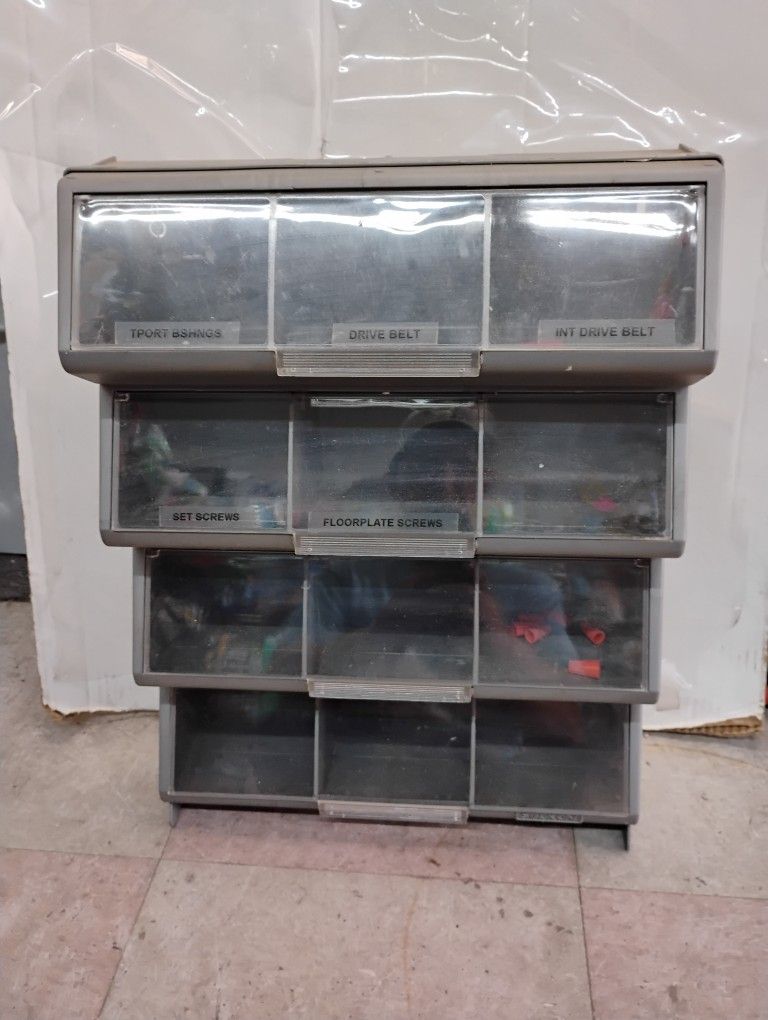 Modular storage organizer with tilt-out bins also ready to hang