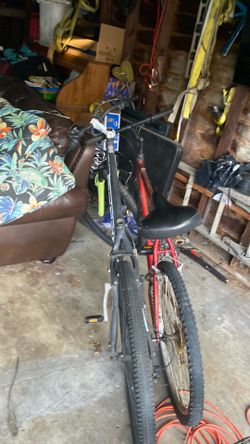Two bikes, one that doesn’t have a chair one does