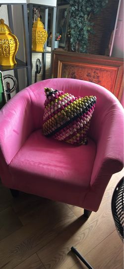 Beautiful pink comfy chair if looking to bring a pop of color to a room!
