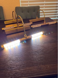 Gold picture lights.