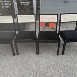 4 wooden black Chairs with Rattan Backs  19” wide  18” deep  18 “ floor to seat  33” tall in back 