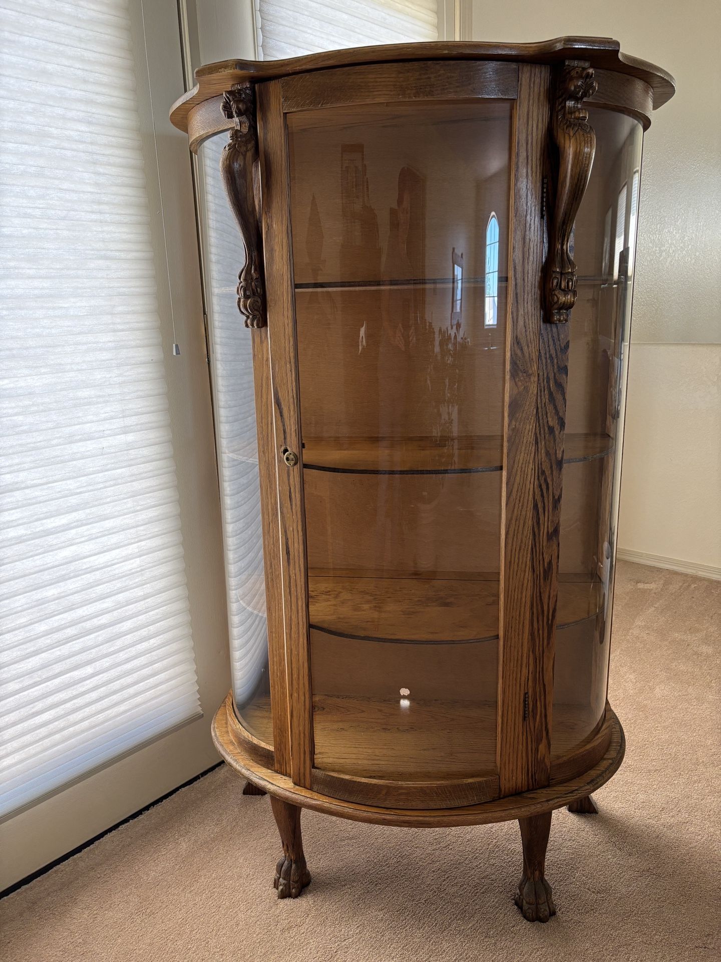 Antique Oak Curio Cabinet with Curved Glass, Lion Heads & Claw Feet