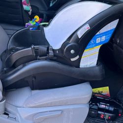 Baby carrier and car seat base
