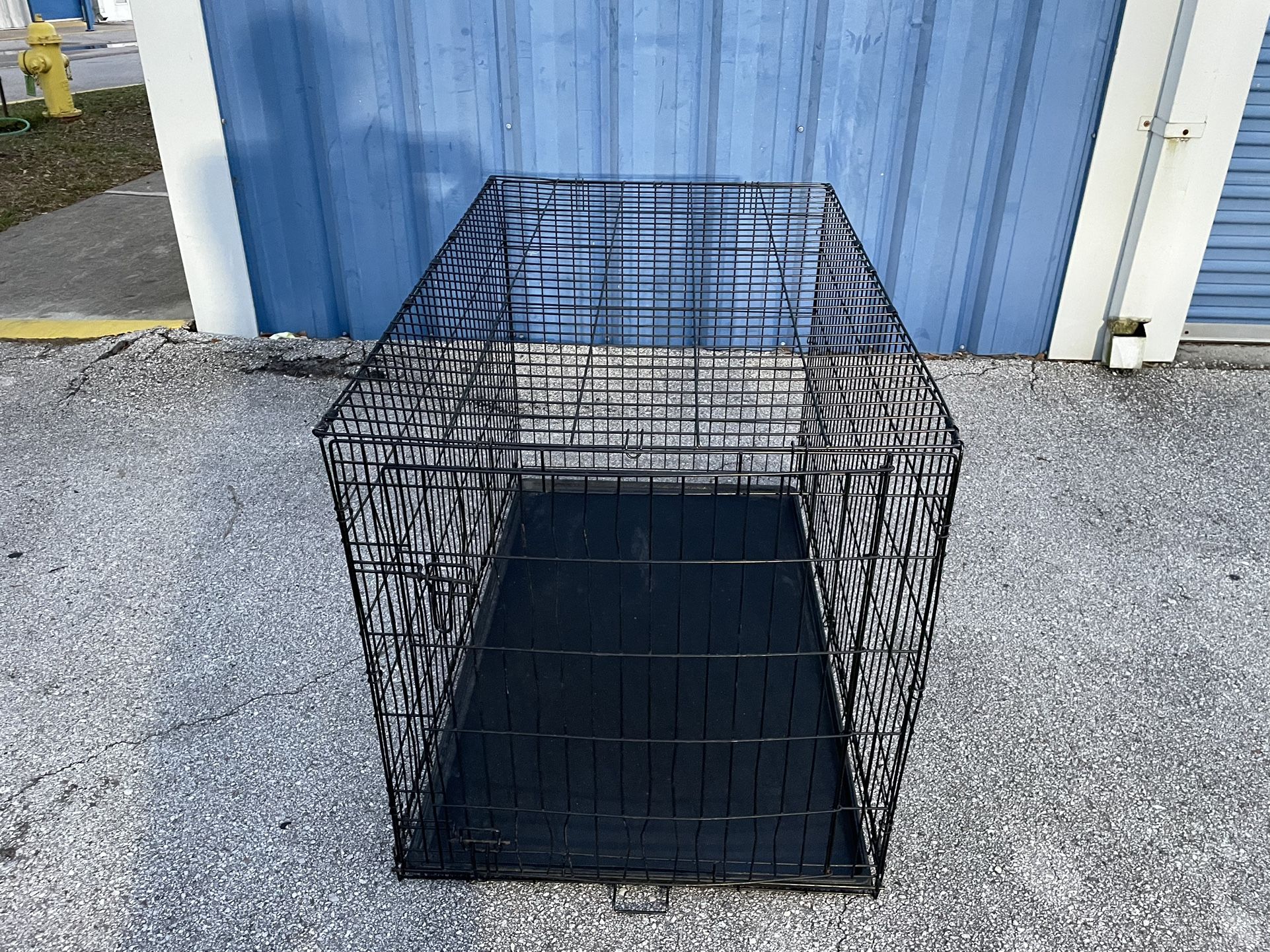 Dog Kennel -( size: 30”x 48”x 33”in high )- Used good/fair condition 