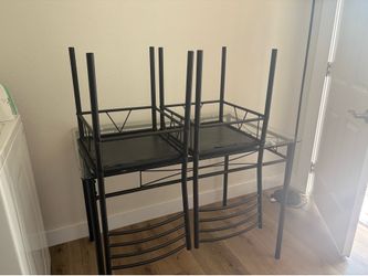 Glass dining table comes with 4 chairs