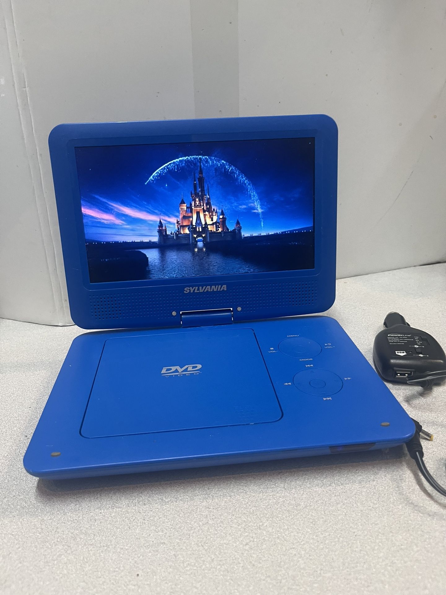 Sylvania SDVD9020B 9” swivel screen, portable DVD player USB/SD The player works great. Good battery. INCLUDES CAR CHARGER ONLY. The battery cover i
