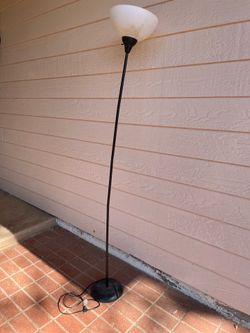 Black metal torch floor lamp