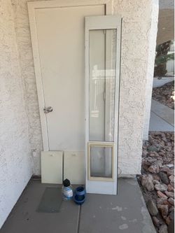 dog door with brand new water jug for dogs