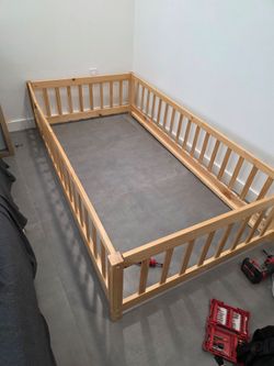 Twin wood floor bed