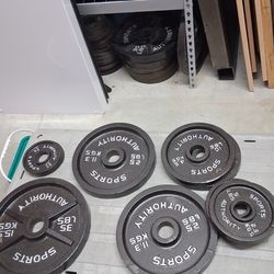 Olympic plates 45,35,25,10,5,2.5. Bar and weight tree,