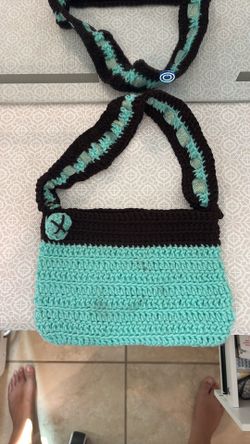 crochet teal and brown button bag.