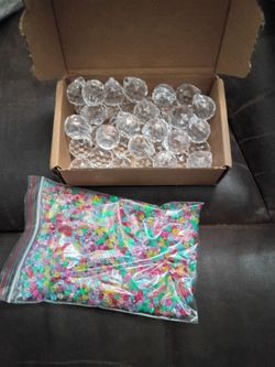 Acrylic sun catchers and plastic bag of beads.. various colors...