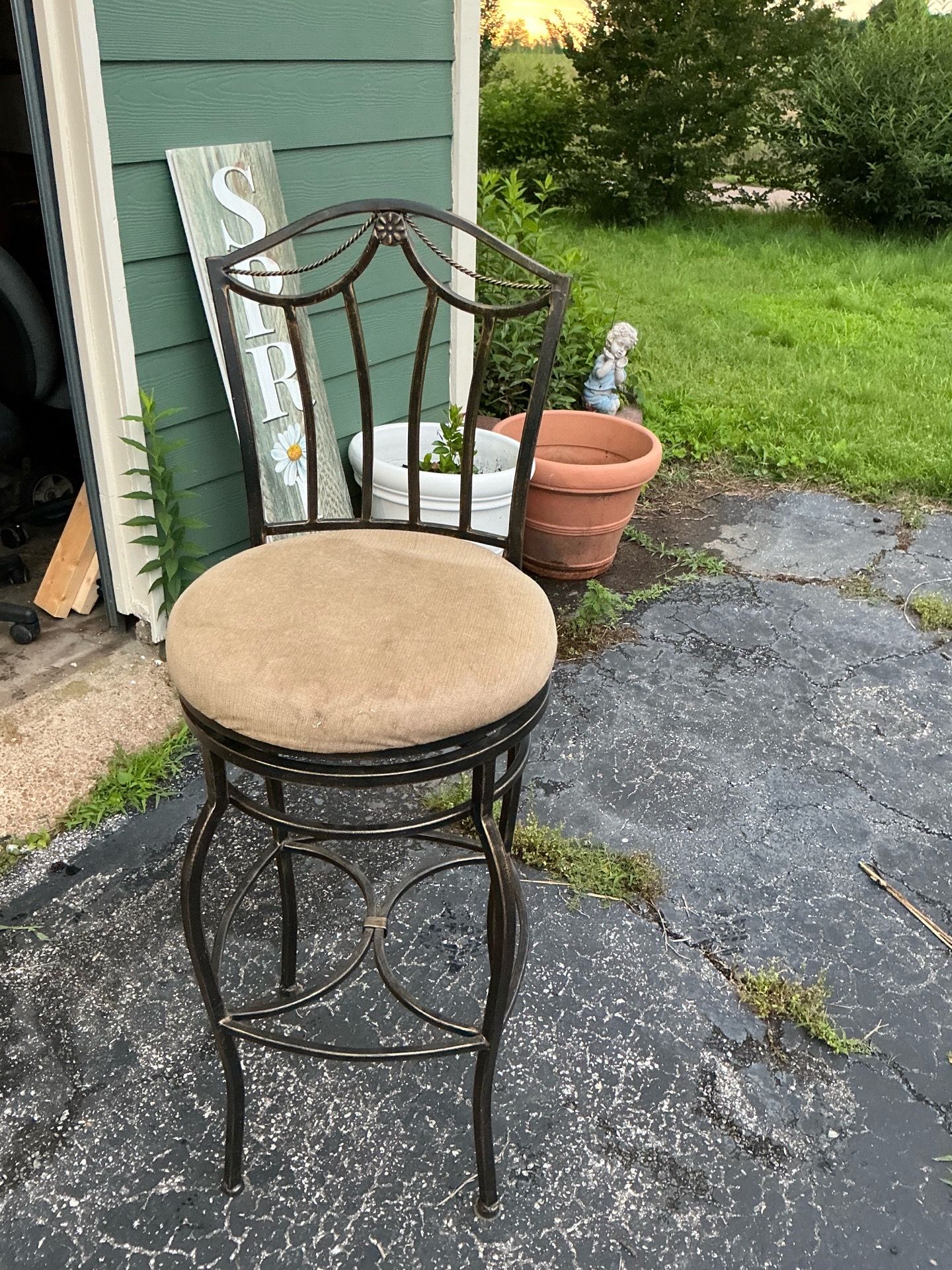 Used Set of 3 Wrought Iron Swivel Bar Stools W/Decorative Backs Sturdy well built frame with integrated foot rest Cushions need a deep clean o