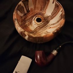Vintage porcelain ceramic tobacco pipe bowl. Comes with a nice pipe (no bite marks) And Zippo lighter.
