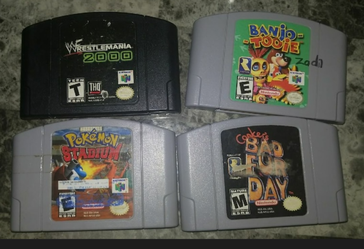 4 N64 games bad fur day, banjo tooie, Pokemon stadium, WrestleMania 2000
