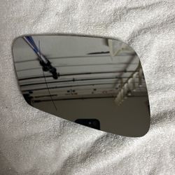 Passenger side heated mirror glass