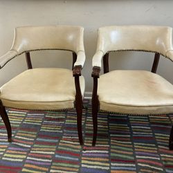 2 Beige Mid-century Modern  Vinyl Upholstered Captain's chairs with Dark Wood Frame & Studded Nailhead Trim.